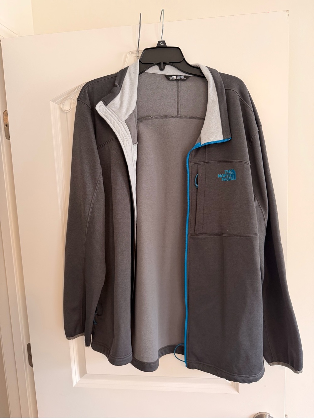 The North Face Men's Dark Gray Fleece Jacket with Blue Accents